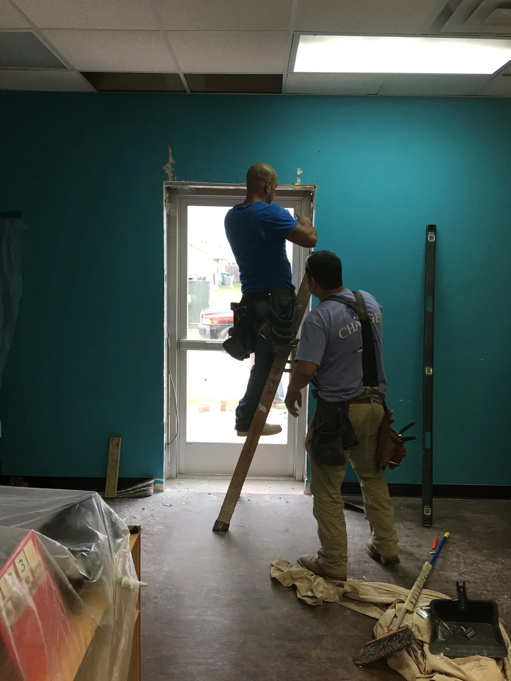 EGA Construction Services subcontractor crew framing a tenant finish-out